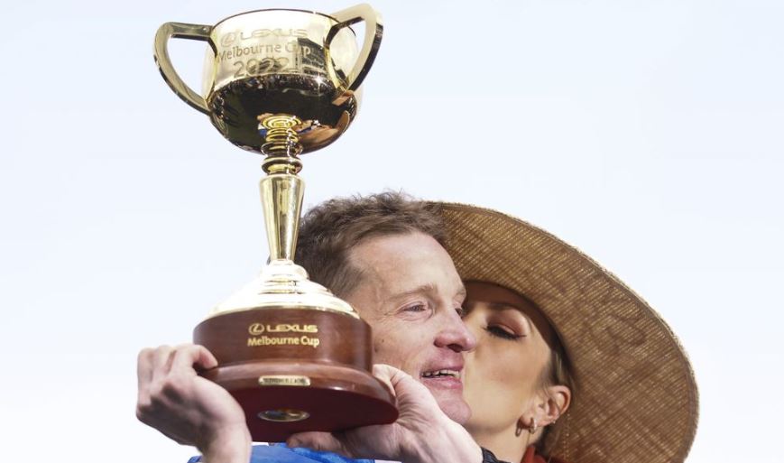Mark Zahra, who rode Gold Trip to victory, celebrates with the trophy after winning the 2022 Melbourne Cup